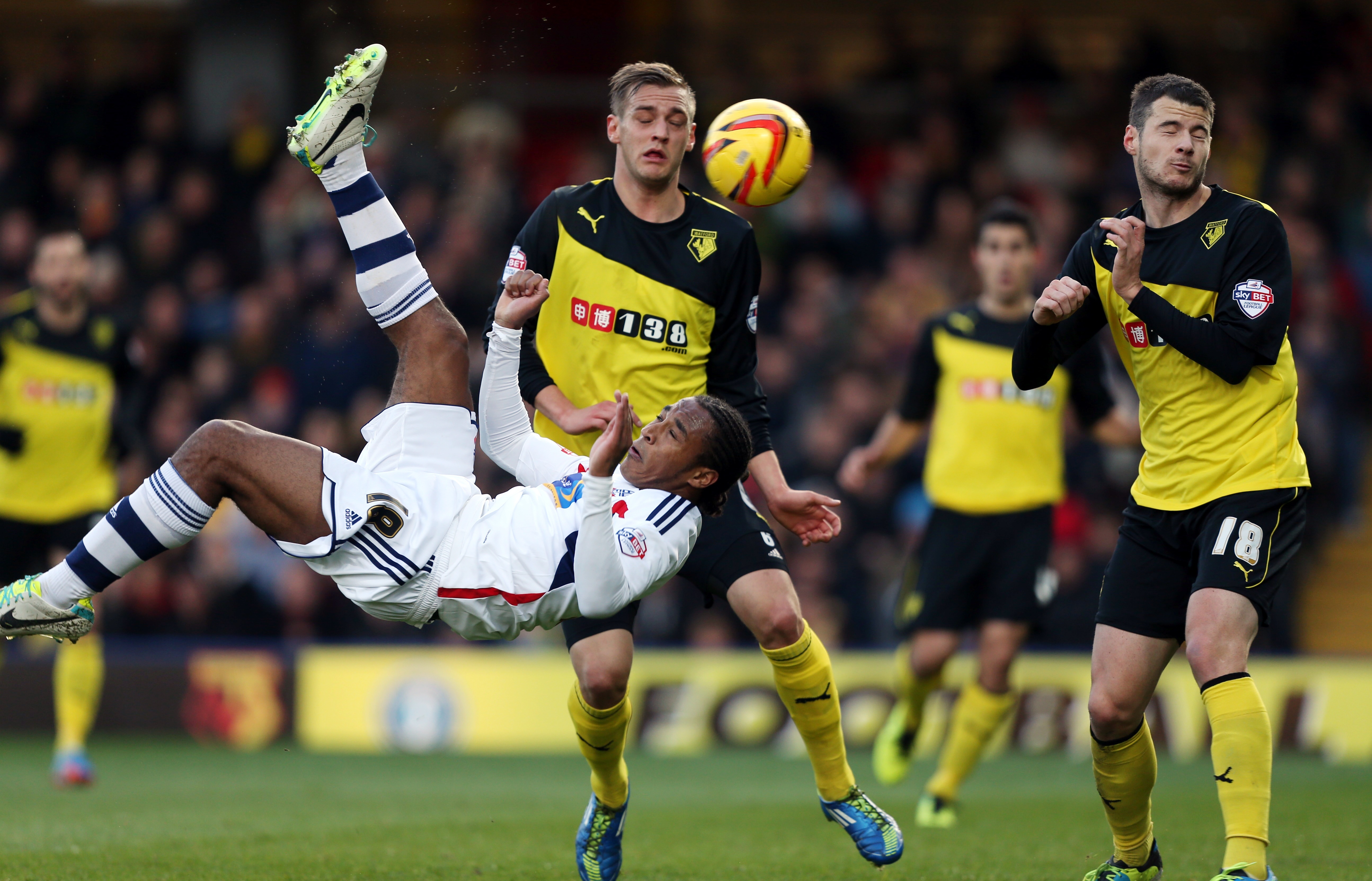 Bolton Wanderers' Neil Danns attemps an overhead kick as Daniel Pudil - Watford looks on 4 simple rules for mastering the overhead kick